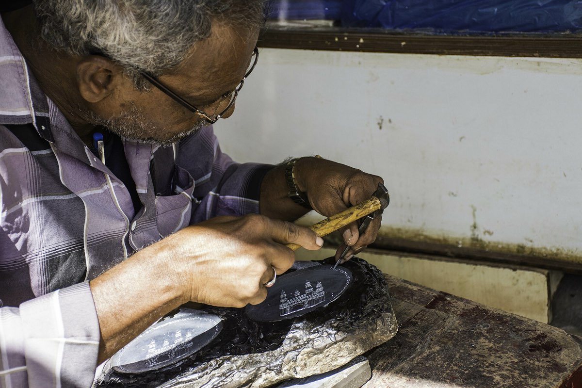 A craftsman engraving bidriware in Bidar