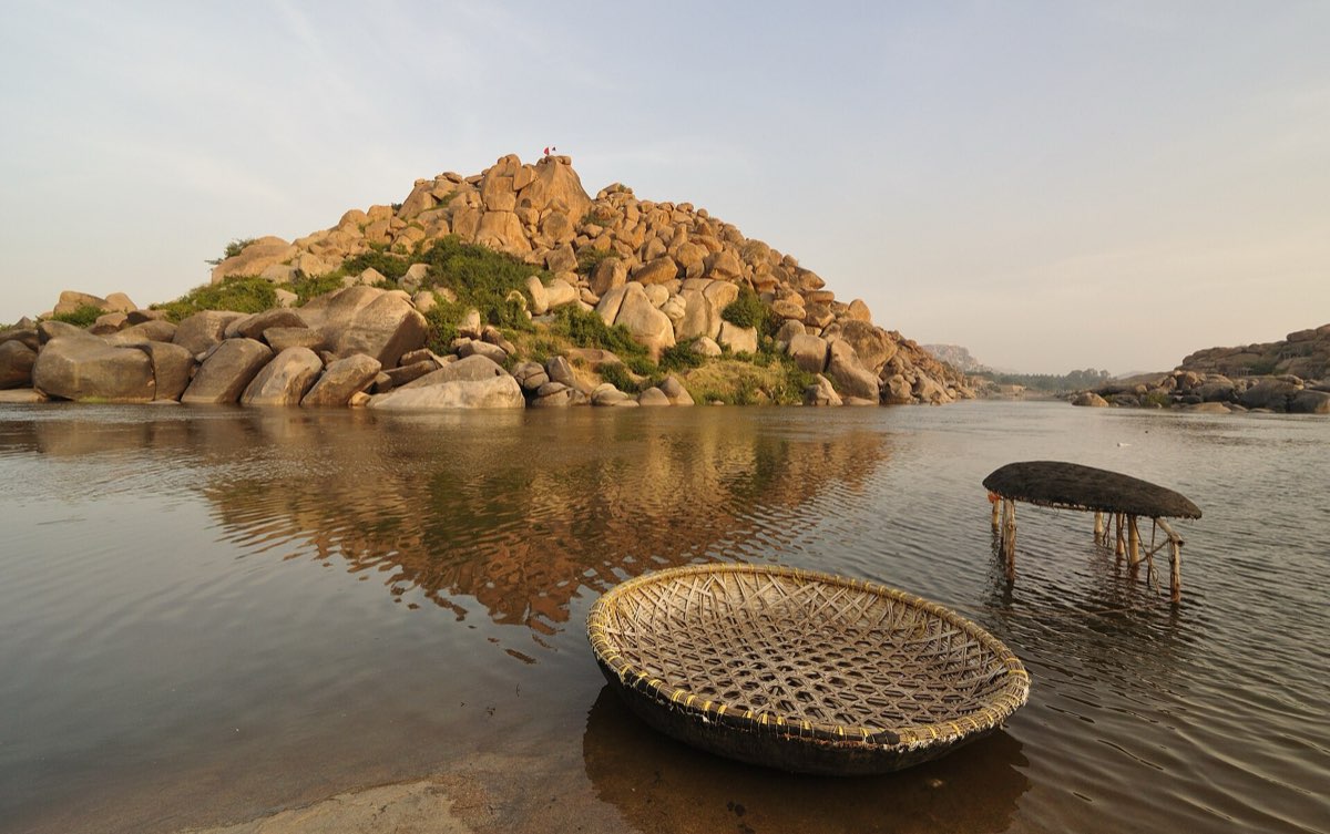 Coracles on the Tungabhadra river at Hampi