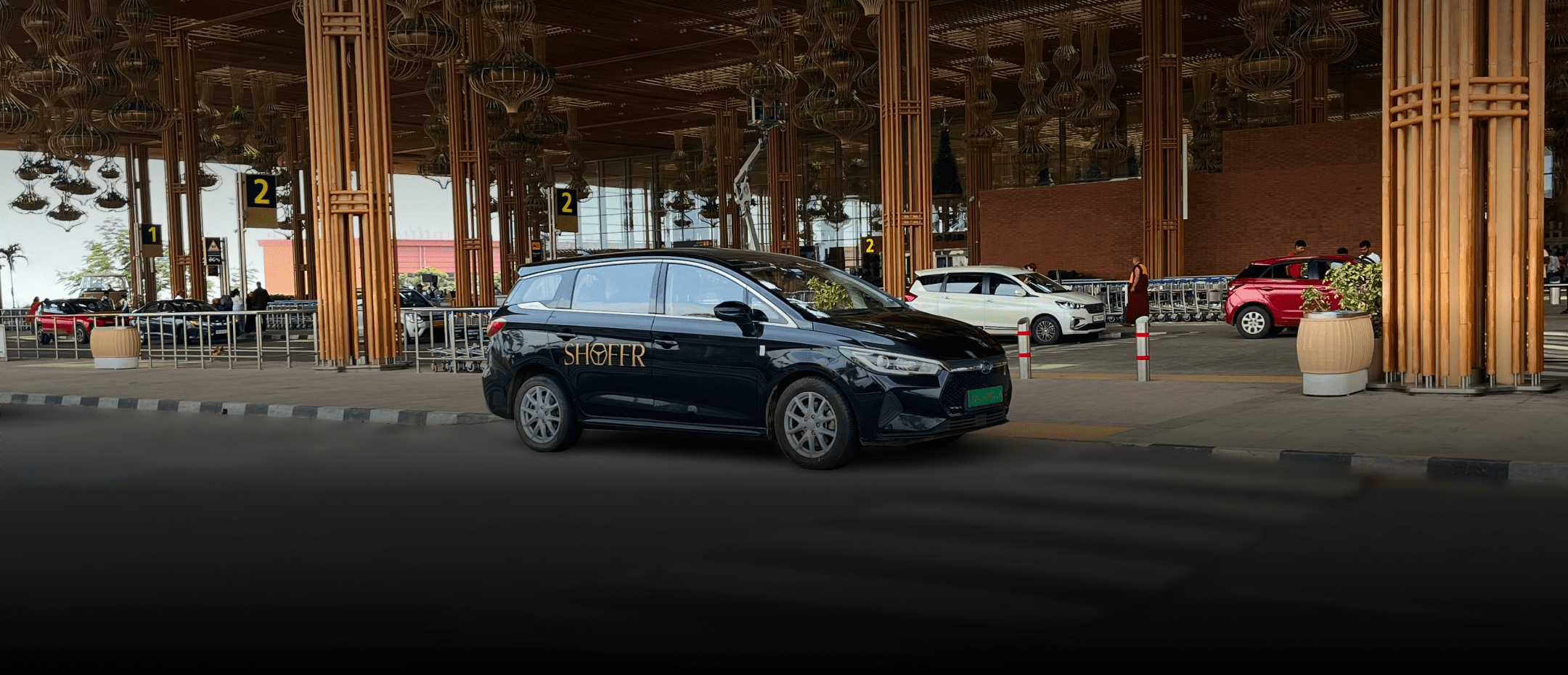 A Shoffr BYD e6 waiting at the airport terminal